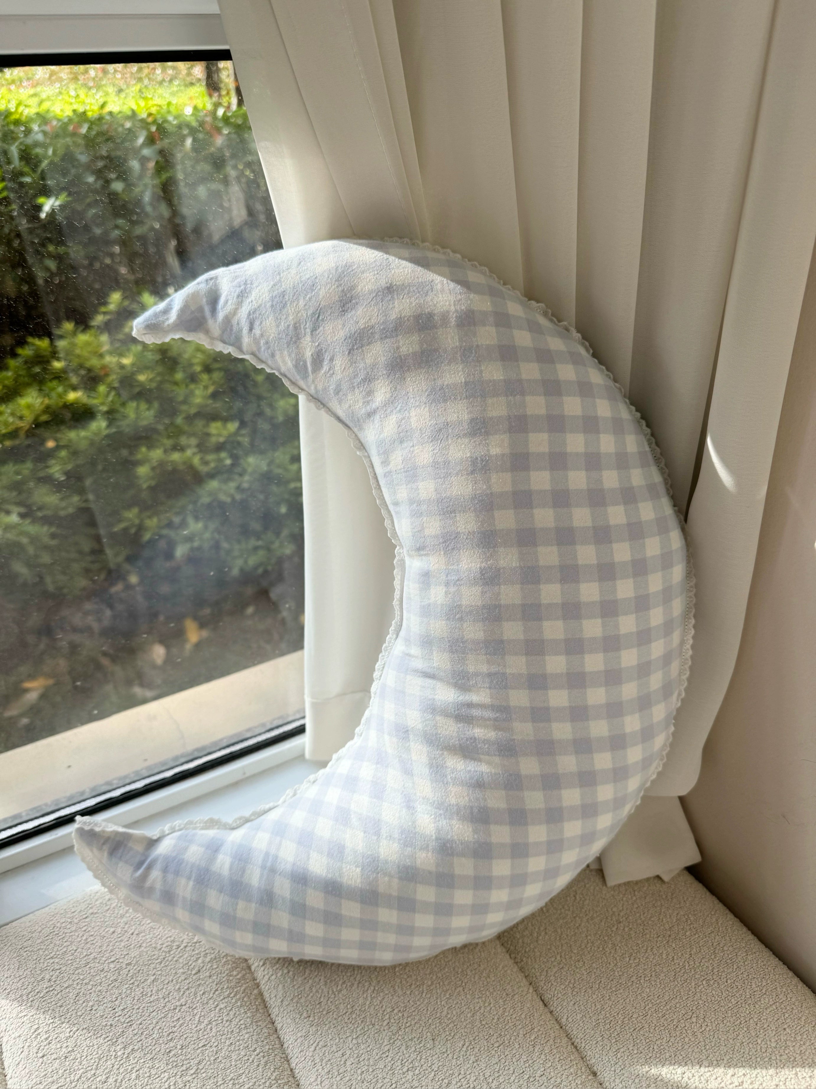 checked crescent moon pillow