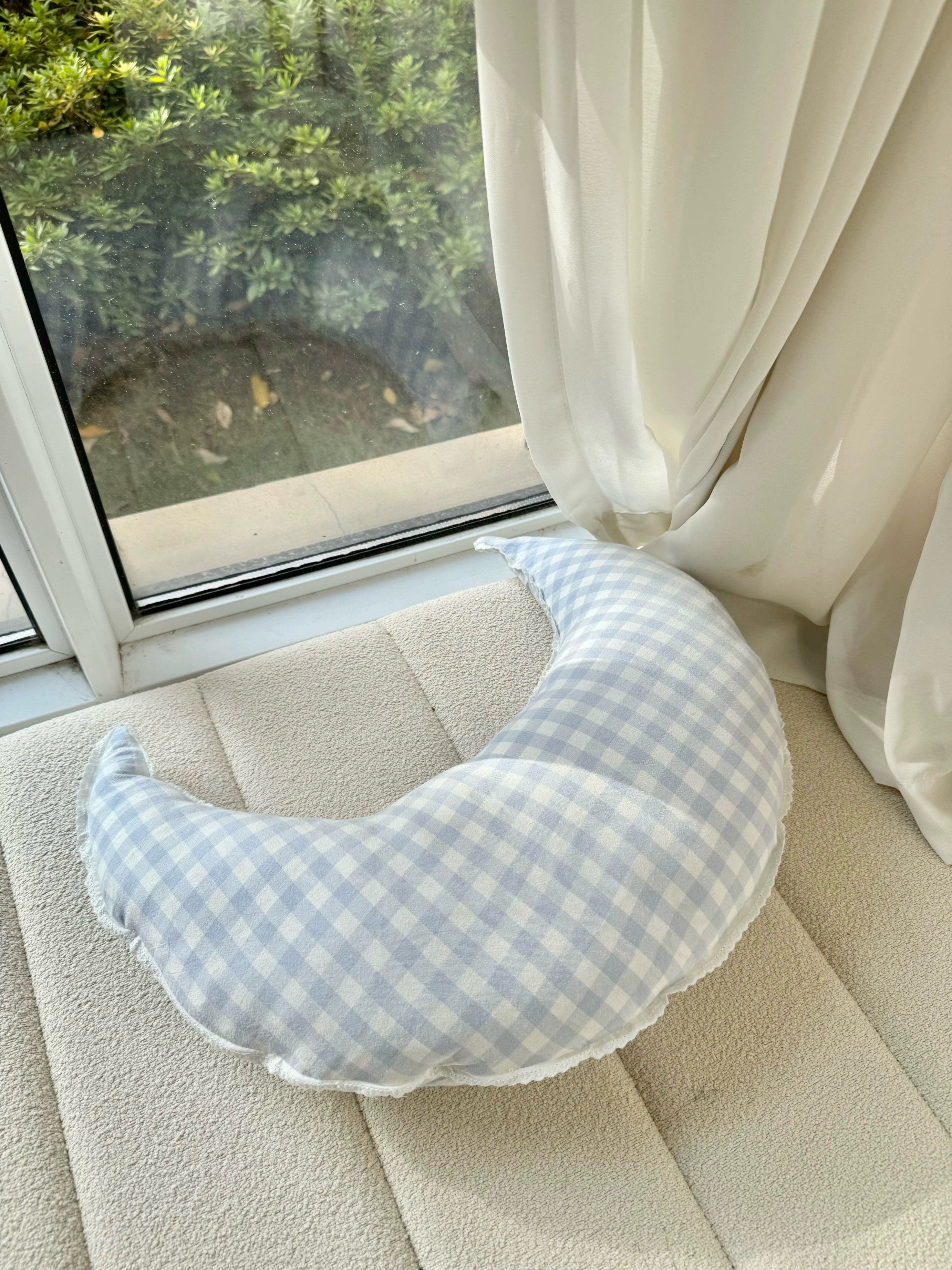 checked crescent moon pillow