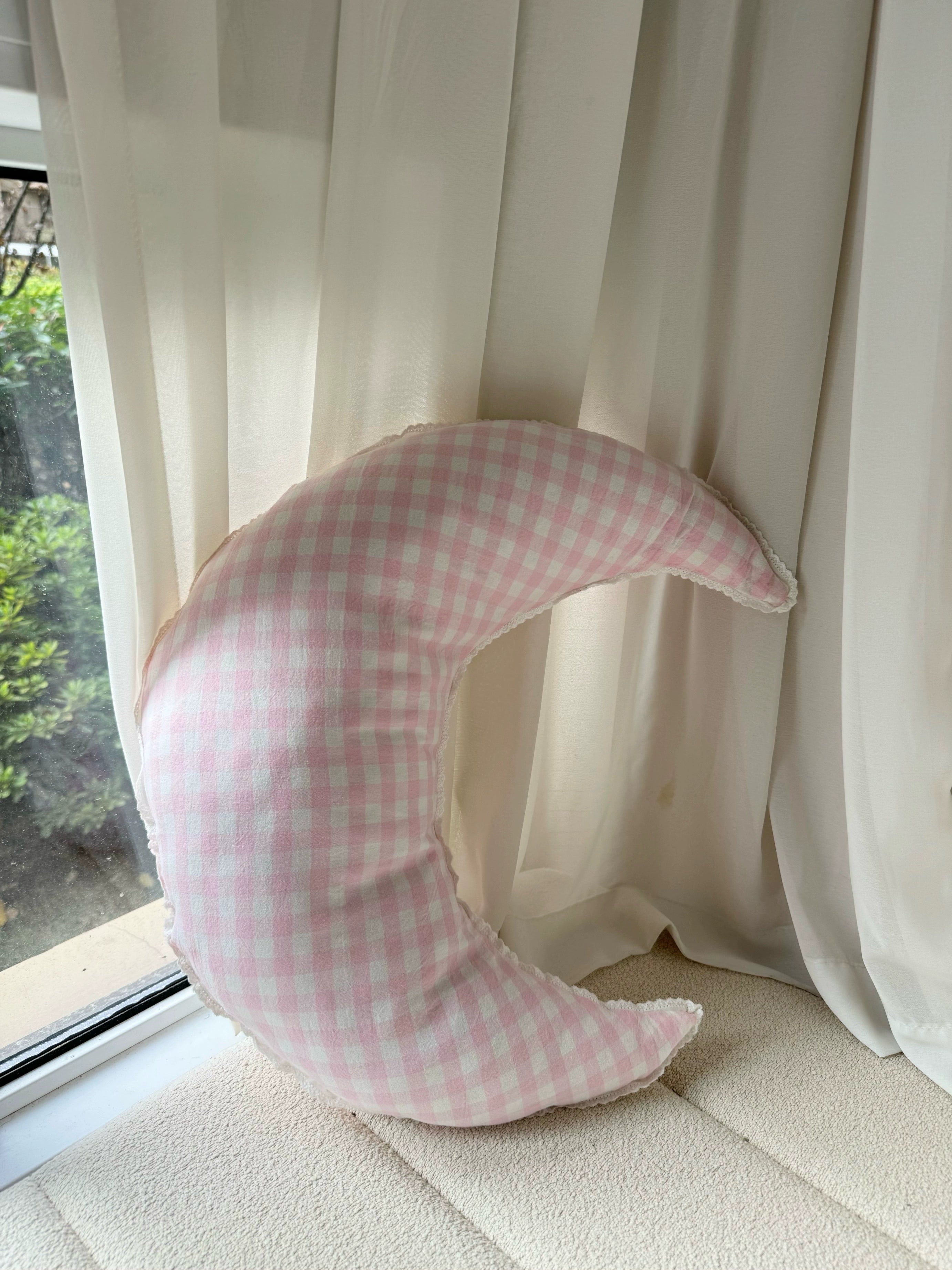 checked crescent moon pillow